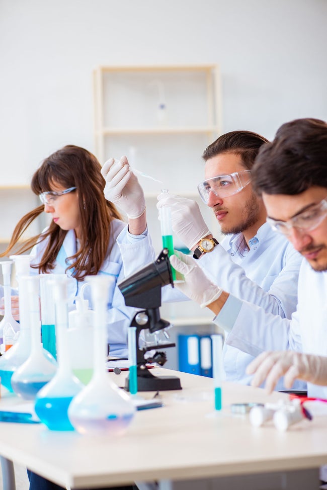 Team of chemists working in the lab